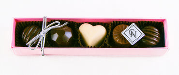 The Pink Fabulous 5 Piece Box of All kinds of chocolates features the following flavours: White Chocolate Caramel, Blood Orange, Milk Chocolate Caramel, Chocolate Lime, By Christopher Norman Chocolates