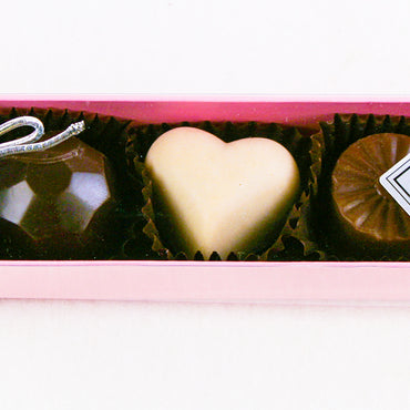 The Pink Fabulous 5 Piece Box of All kinds of chocolates features the following flavours: White Chocolate Caramel, Blood Orange, Milk Chocolate Caramel, Chocolate Lime, By Christopher Norman Chocolates